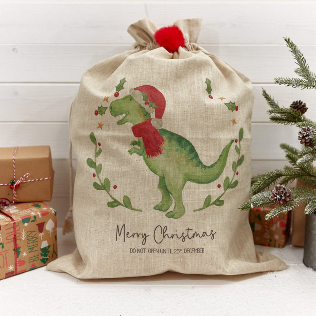 Richard Langs Christmas Present Sack - Festive Dinosaur with Pom-Pom