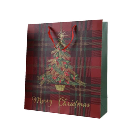 A 48cm red tartan paper gift bag with a Christmas tree and 'Merry Christmas' text design, with red ribbon handles.