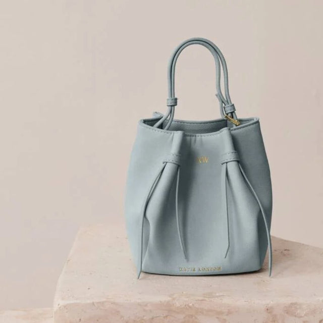 Katie Loxton Blue Celina Mini Suedette Bucket Bag - Old Railway Line Garden Centre