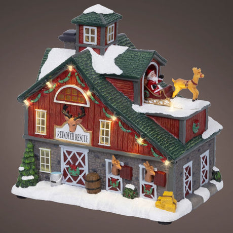 Lumineo 22cm LED Christmas Village Reindeir Rescue Barn House - Battery Operated