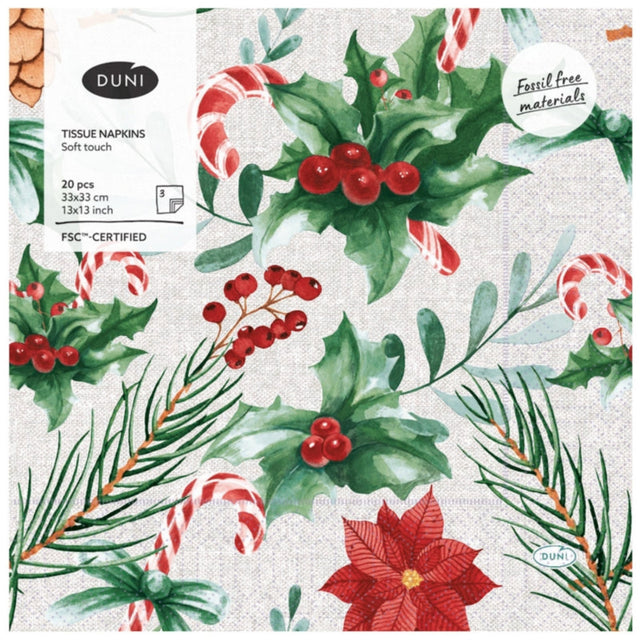 Pack of DUNI tissue napkins with Christmas-themed design featuring holly leaves, berries, and candy canes.