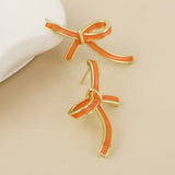 POM Seraphina Stainless Steel Gold Plated Orange Enamel Bow Earrings