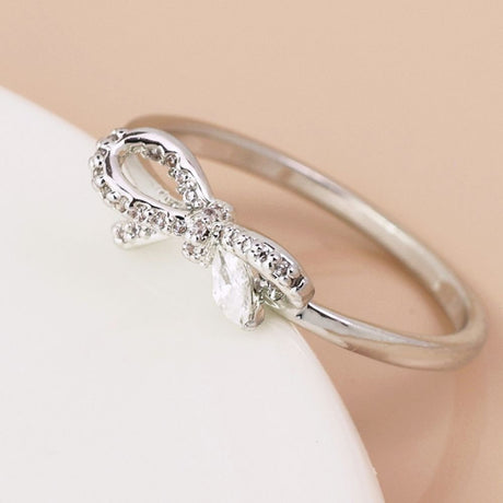 POM White Gold Plated Asymmetric Crystal Bow Ring (Medium-Large) - Old Railway Line Garden Centre