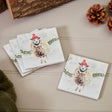 Set of coasters with sheep illustrations on a wooden surface