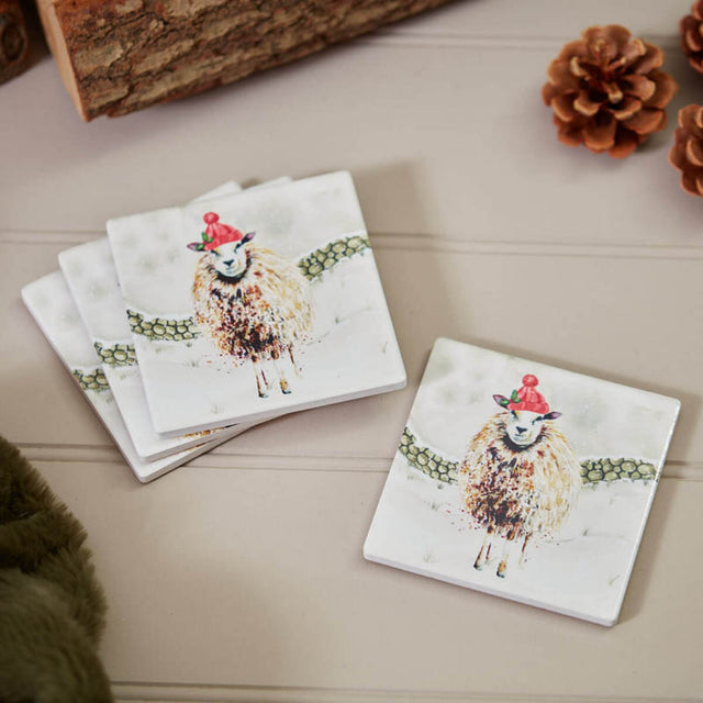 Set of coasters with sheep illustrations on a wooden surface