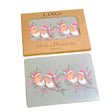 Set of 4 placemats with Christmas design in a 'Langs' box on a wooden surface.